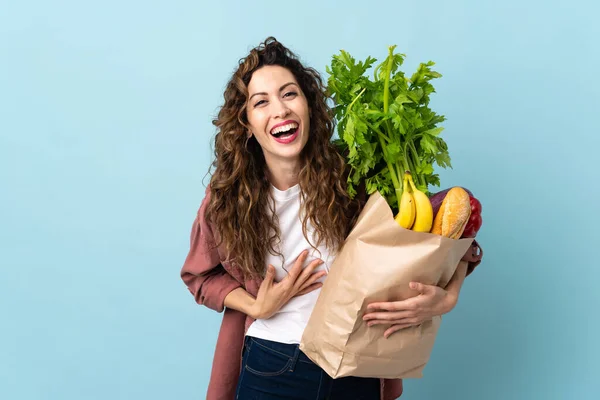 Young Woman Holding Grocery Shopping Bag Isolated Blue Background Smiling — Stock Photo, Image