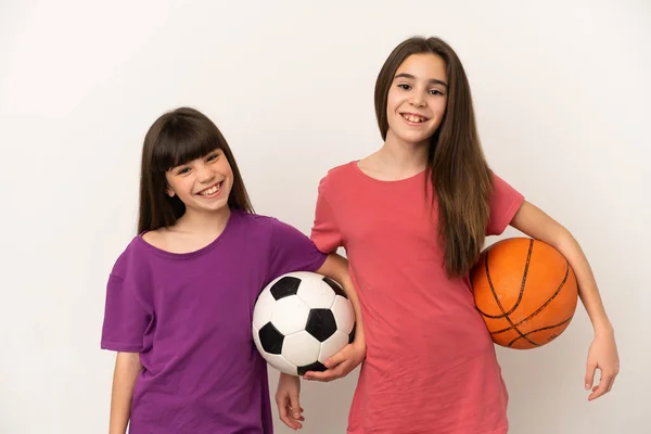 Hermanitas Jugando Fútbol Baloncesto Aisladas Sobre Fondo Blanco Posando Con —  Fotos de Stock