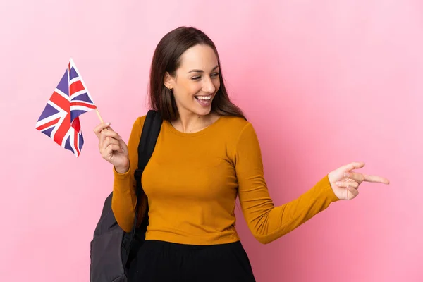 Young Hispanic Woman Holding United Kingdom Flag Pointing Finger Side — Stock Photo, Image