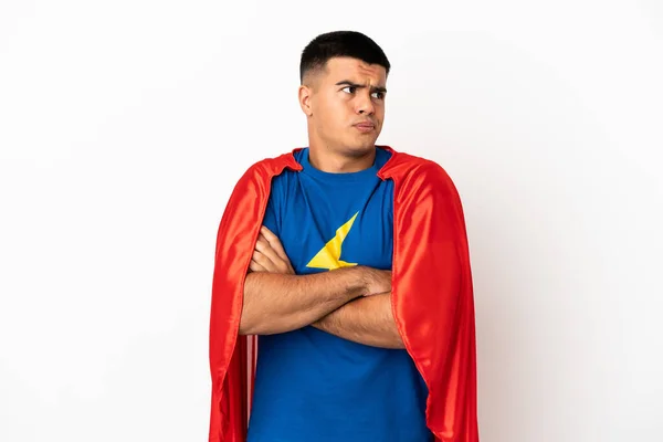 Super Hrdina Přes Izolované Bílé Pozadí Dělat Pochybnosti Gesto Při — Stock fotografie