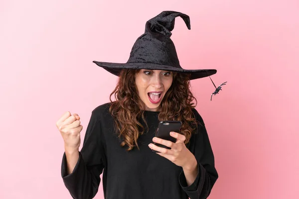 Young Caucasian Woman Celebrating Halloween Isolated Pink Background Surprised Sending — Stock Photo, Image