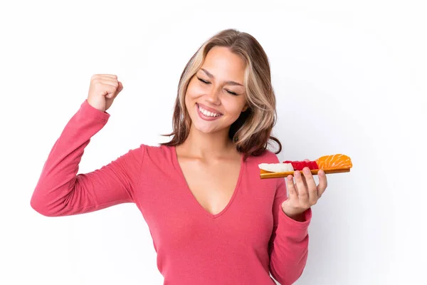 Joven Chica Rusa Sosteniendo Sashimi Aislado Sobre Fondo Blanco Celebrando — Foto de Stock