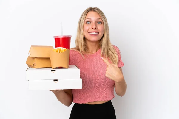 Young Caucasian Woman Holding Fat Food Isolated Blue Background Surprise — Stock Photo, Image