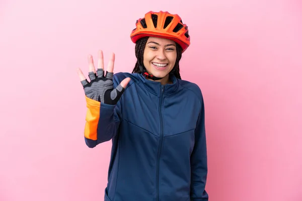 Tini Kerékpáros Lány Elszigetelt Rózsaszín Háttér Számolás Ujjal — Stock Fotó