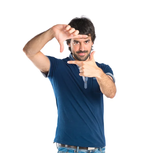 Homem focando com os dedos em um fundo branco — Fotografia de Stock