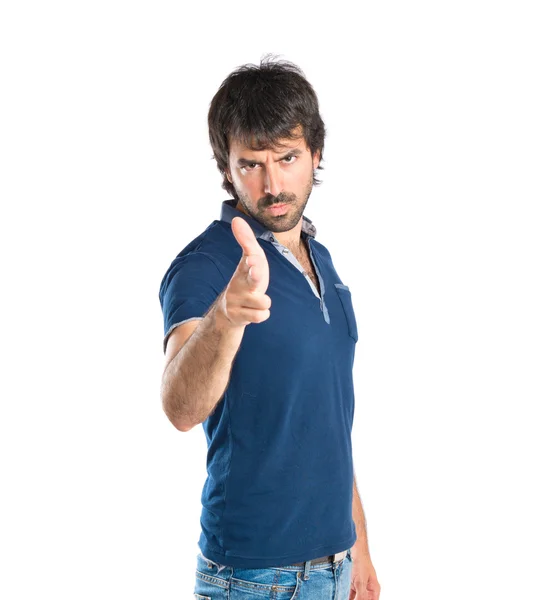 Man making gun gesture over white background — Stock Photo, Image