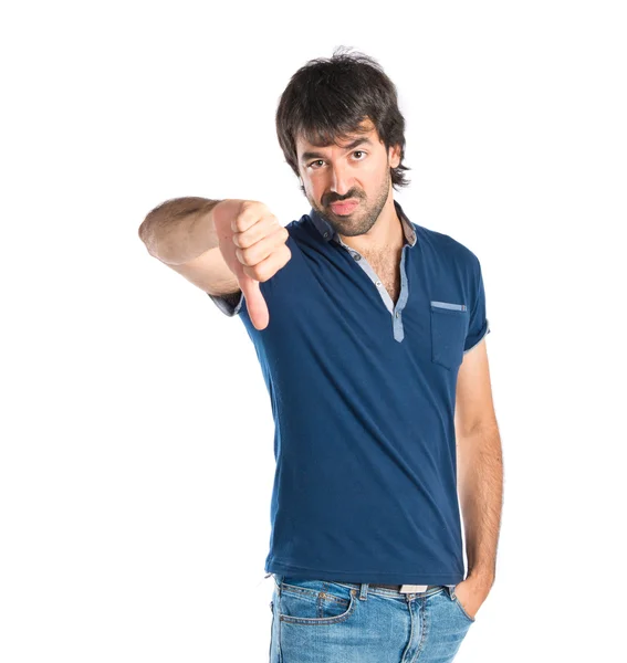 Man doing a bad signal over white background — Stock Photo, Image