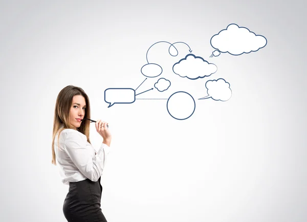 Young businesswoman over grey background — Stock Photo, Image