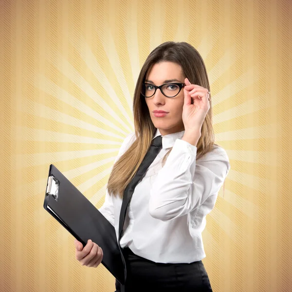 Businesswoman over ocher background — Stock Photo, Image