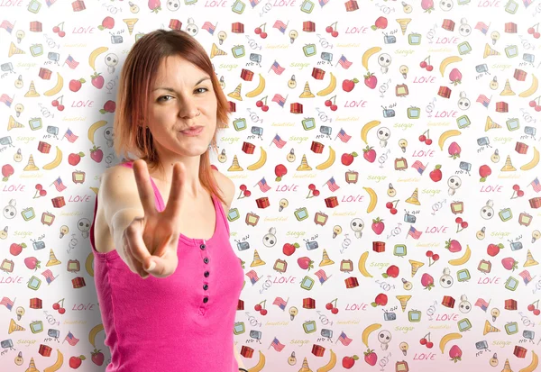 Pretty young woman winner over cute background — Stock Photo, Image