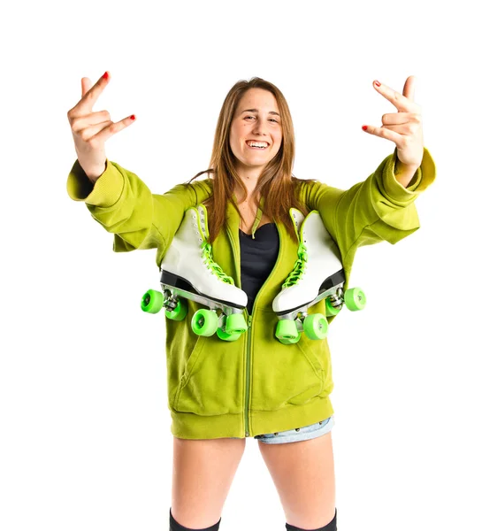 Young girl making horn gesture over white background — Stock Photo, Image