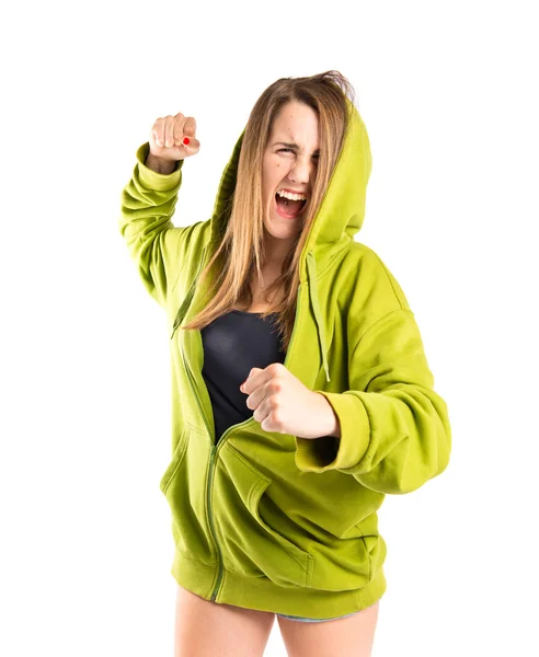 Girl giving punch over isolated white background — Stock Photo, Image