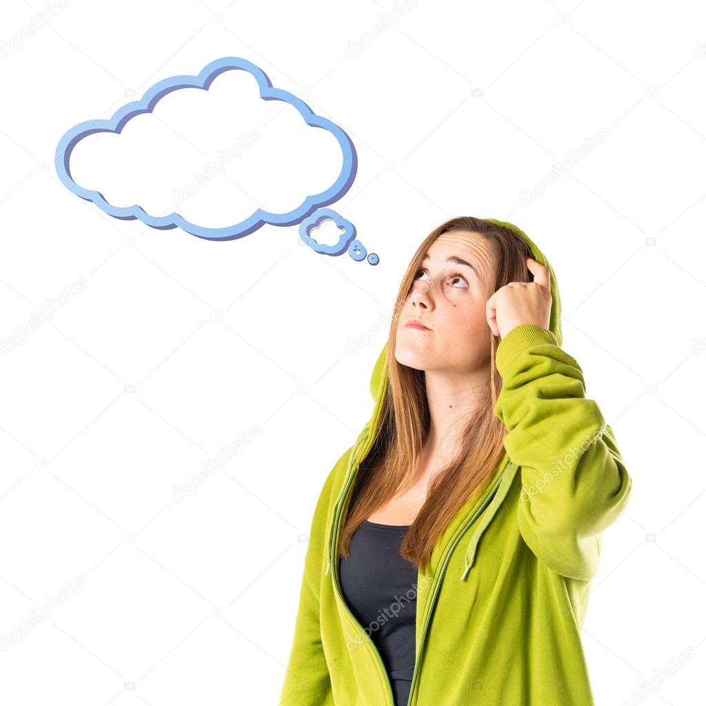 Young girl thinking over isolated white background 