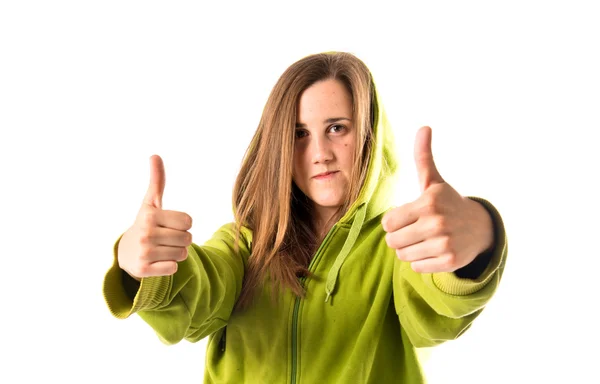 Chica con el pulgar hacia arriba sobre fondo blanco — Foto de Stock