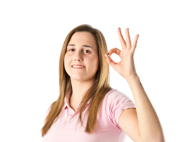 Girl making Ok sign over white background — Stock Photo, Image