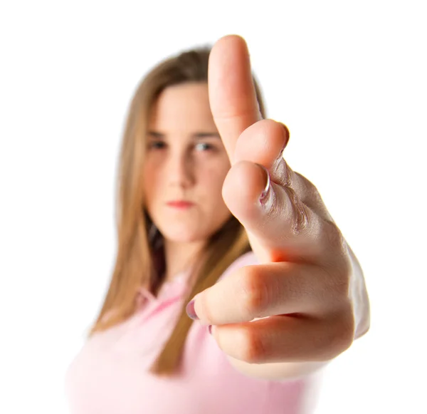 Girl making gun gesture over white background — Stock Photo, Image