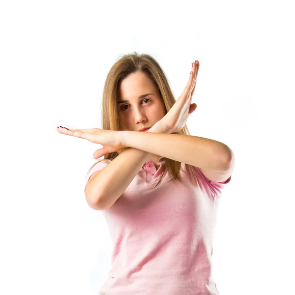 Menina fazendo sinal de parada sobre fundo branco — Fotografia de Stock