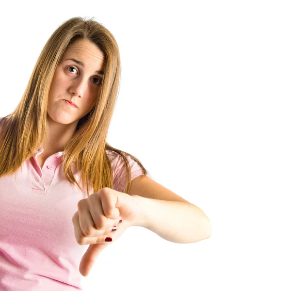 Blonde girl making a good-bad sign over white background — Stock Photo, Image