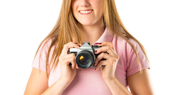 Mädchen beim Fotografieren auf weißem Hintergrund — Stockfoto