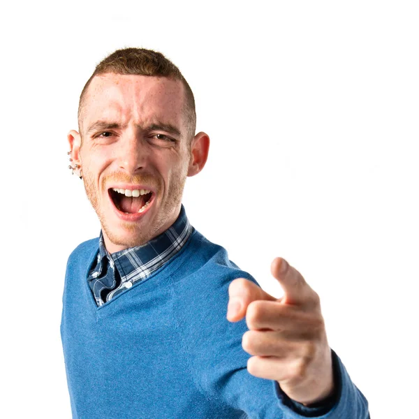 Man pointing to the front over white background — Stock Photo, Image