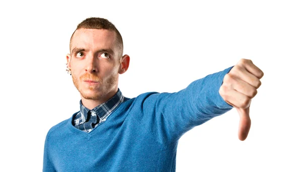 Man doing a bad signal over white background — Stock Photo, Image