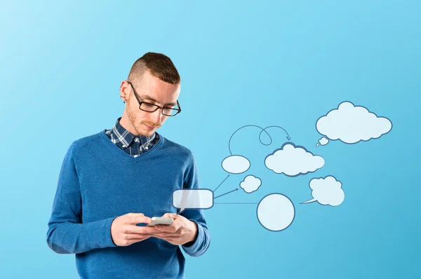 Business man sending a message over blue background. — Stock Photo, Image