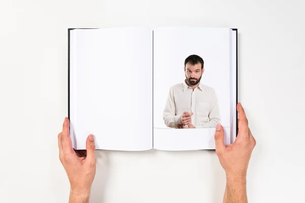 Joven hombre guapo impreso en libro —  Fotos de Stock