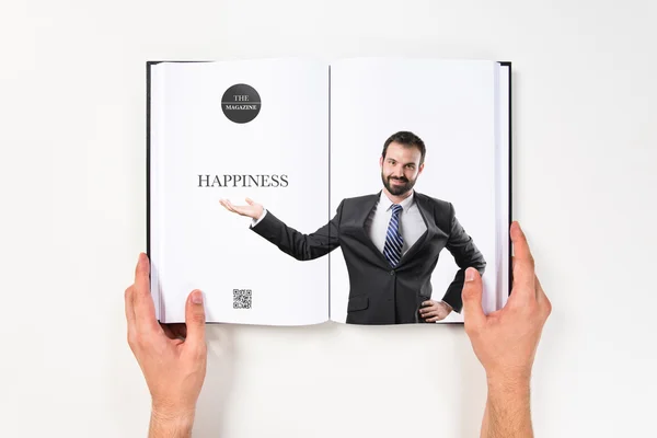 Liikemies tekee osoittaa painettu kirja — kuvapankkivalokuva