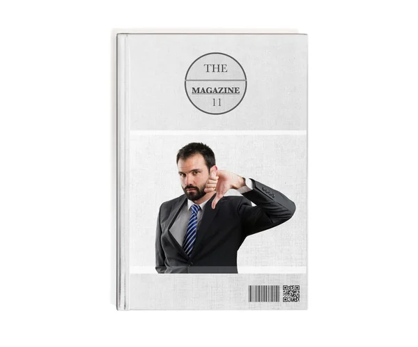 Jonge zakenman met zijn duim naar beneden gedrukt op boek — Stockfoto