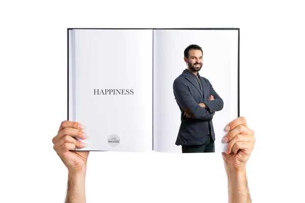 Young handsome man printed on book — Stock Photo, Image