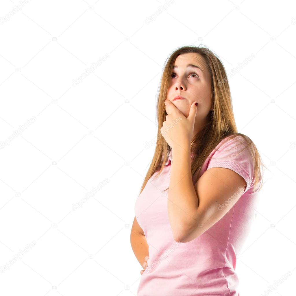 Girl thinking over isolated white background