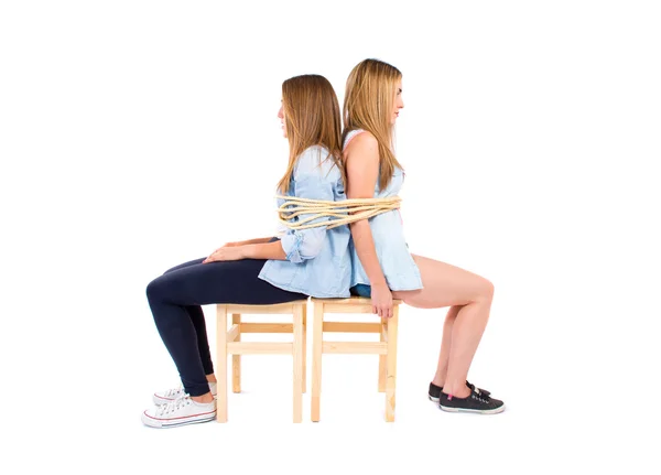 Sisters kidnapped and tied to a chair — Stock Photo, Image