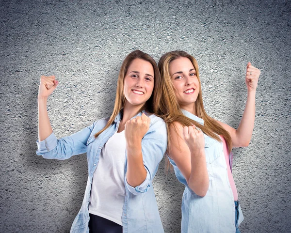 Lucky girls over textured background — Stock Photo, Image