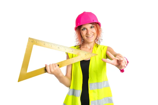 Trabalhador mulher com chanfro sobre fundo branco — Fotografia de Stock