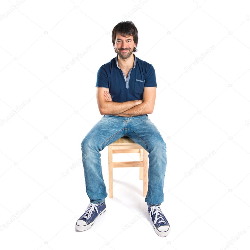 Man with his arms crossed over white background  