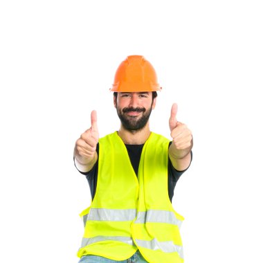 Beyaz arka plan üzerinde başparmak ile işçi