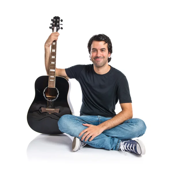 Handsome man with guitar over white background — Stock Photo, Image