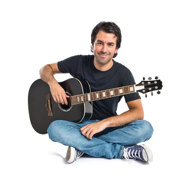 Handsome man with guitar over white background — Stock Photo, Image