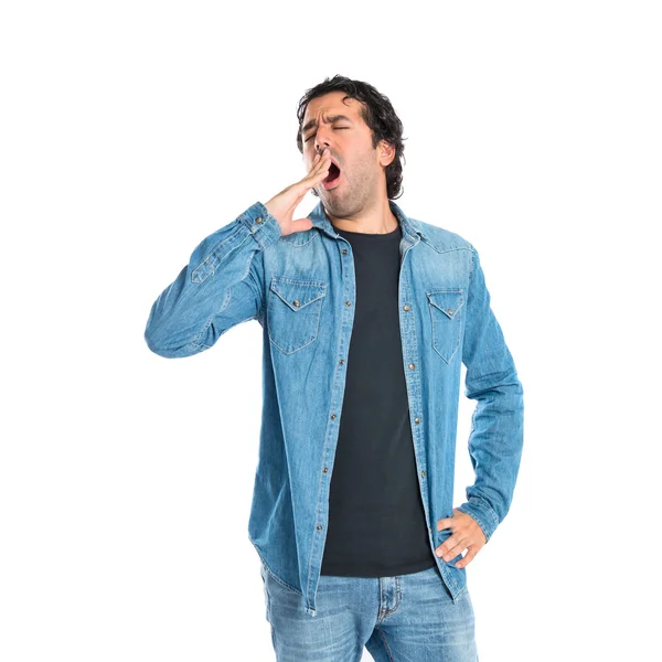 Man yawning over isolated white background — Stock Photo, Image