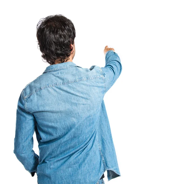 Man pointing back over white background — Stock Photo, Image