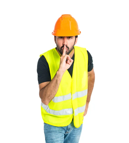 Workman making silence gesture over isolated white background — Stock Photo, Image
