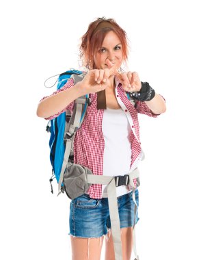 backpacker doing NO gesture over white background