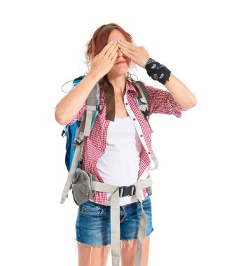 backpacker covering her eyes over isolated white background