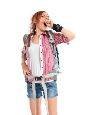 backpacker yawning over isolated white background