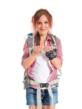 backpacker holding something over white background