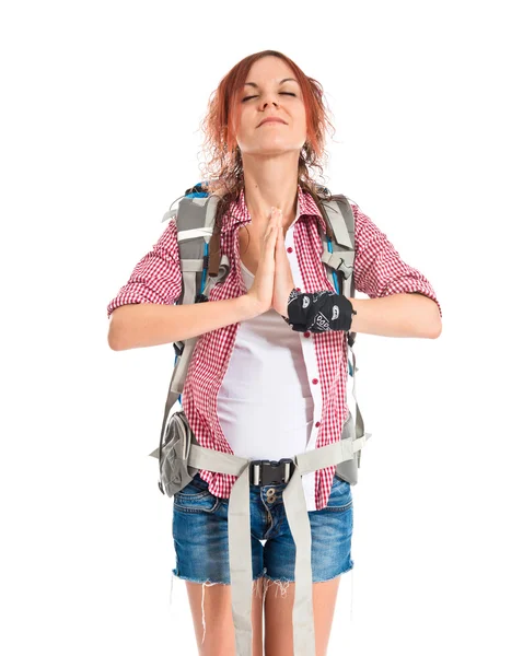 Backpacker in zen position over white background — Stock Photo, Image