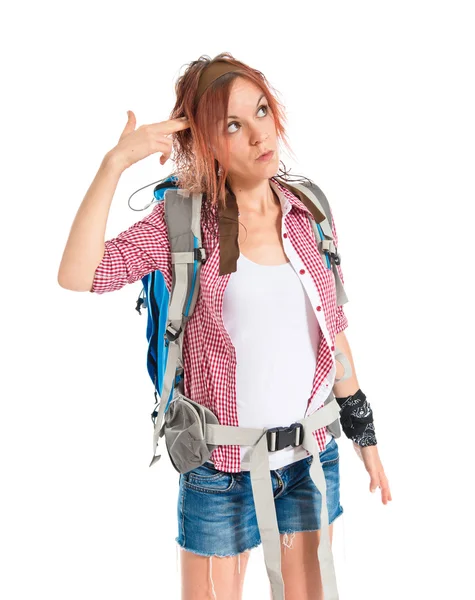 Backpacker making suicide gesture over white background — Stockfoto