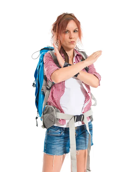 Backpacker facendo stop segno su sfondo bianco — Foto Stock