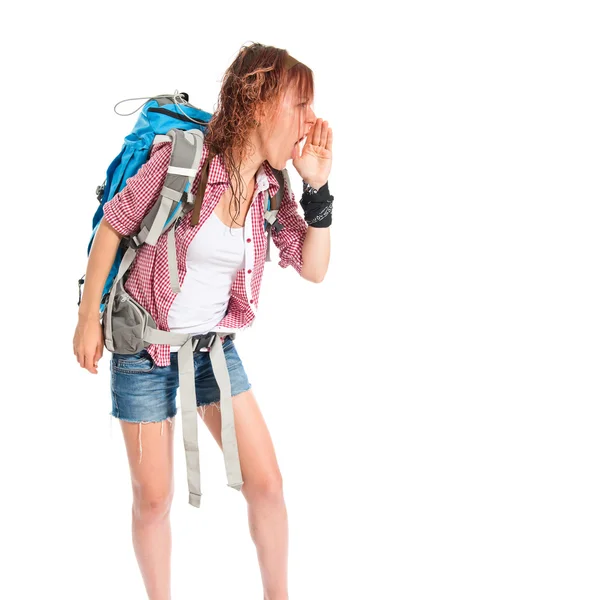 Backpacker shouting over isolated white background — Stock Photo, Image