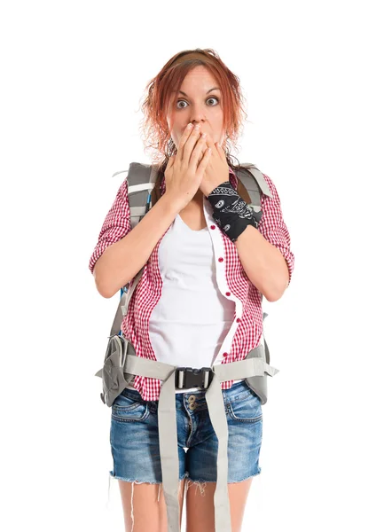 Backpacker doing surprise gesture over white background — Stock Photo, Image